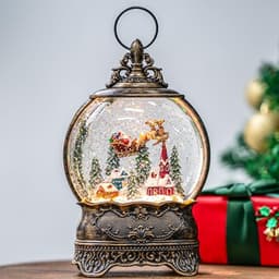 Christmas village snow globe with flying Santa scene, musical water lantern