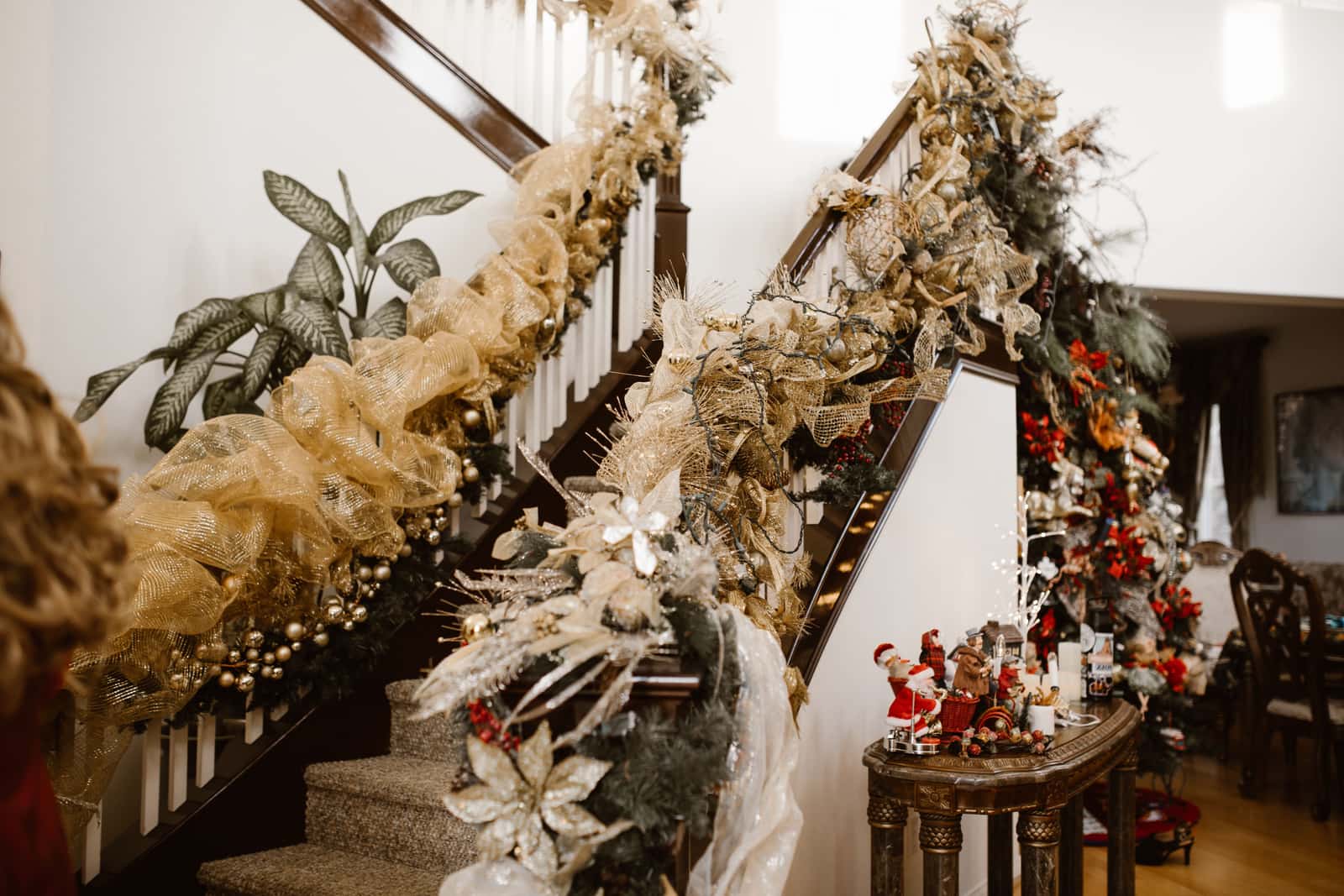 Lit garland wound along a staircase banister